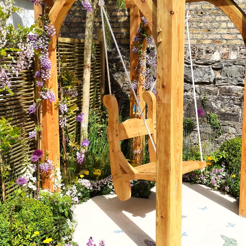 Custom made timber swing with willow fence